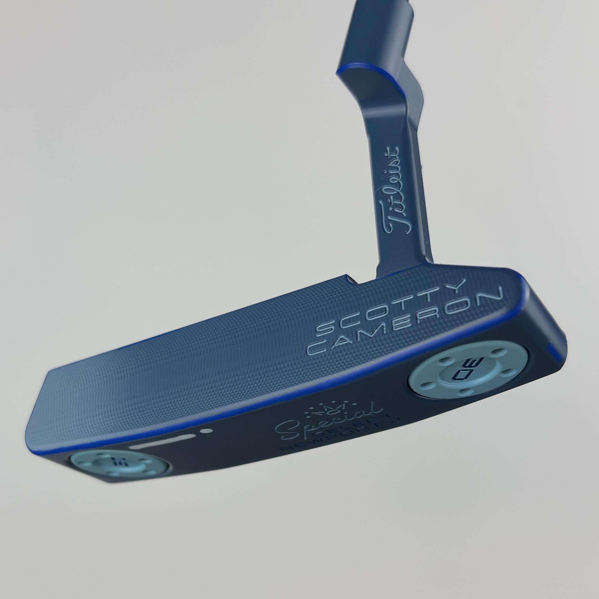 Custom painted Newport 2 from the face side at an angle, the mid-milled face in deep blue with the Scotty Cameron stamp.