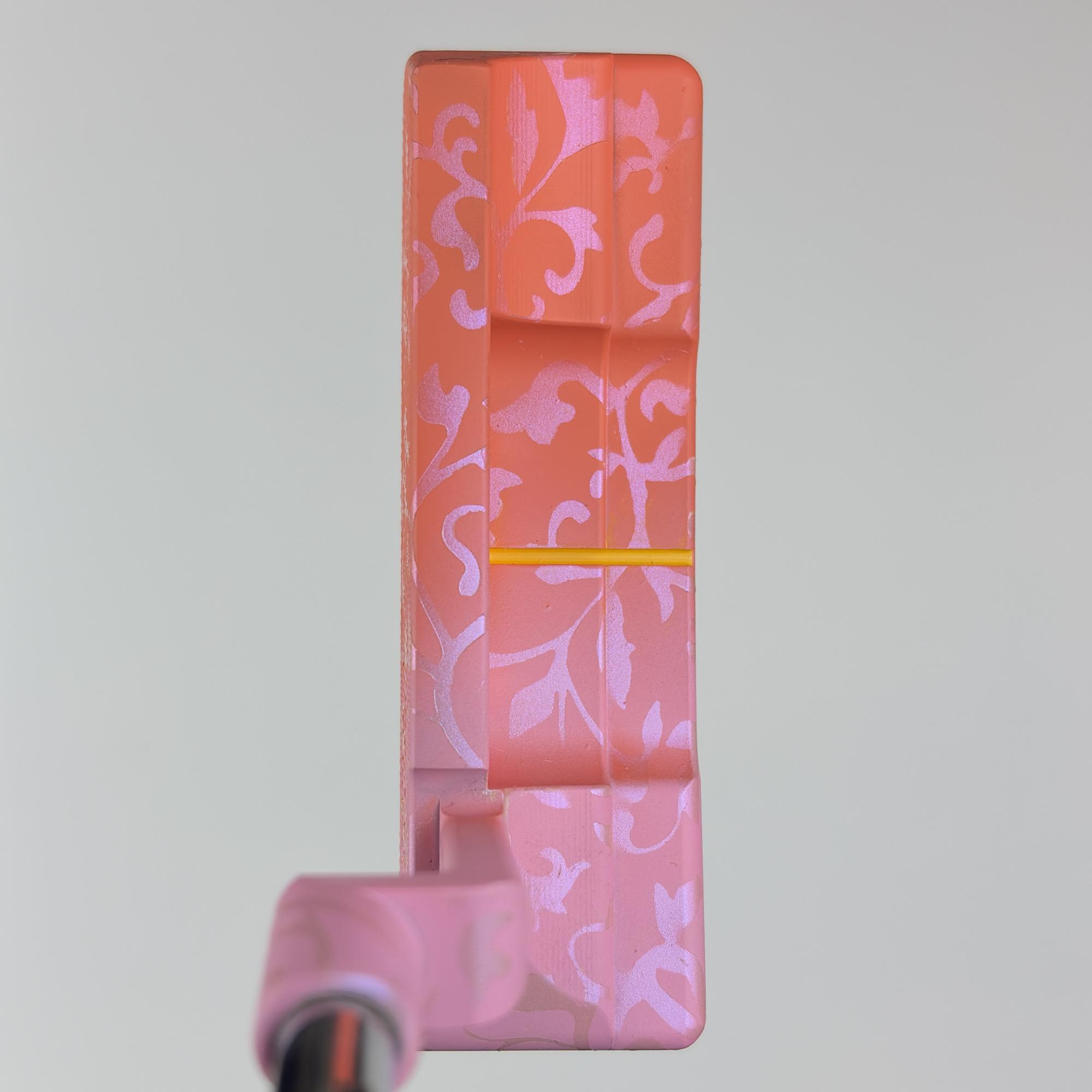 Custom painted Newport 2 Plus from above at address, the wide flange in pink floral with a gold sightline.