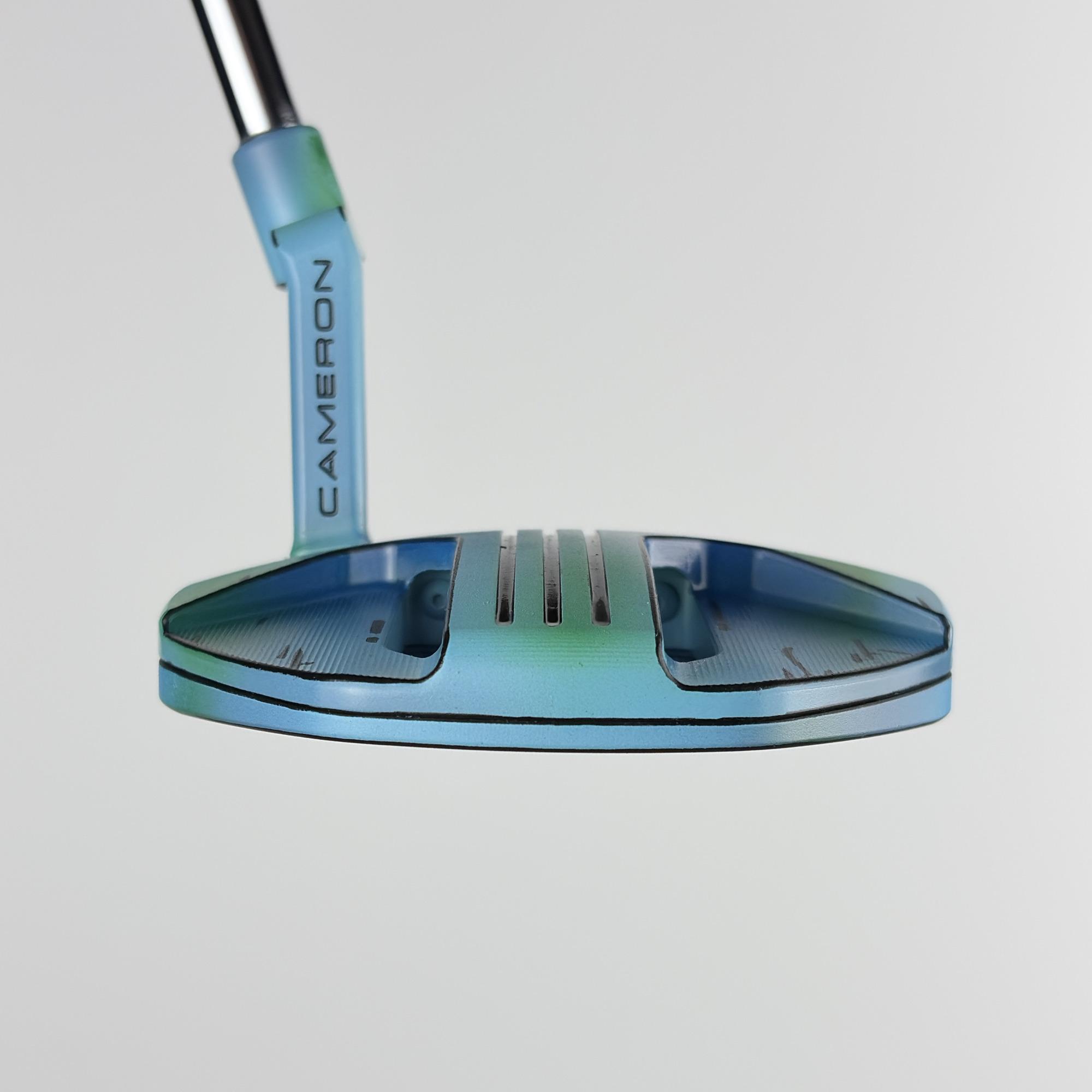 Custom painted Phantom 3.2 at address, the compact mid-mallet body fading from deep blue to sea green.