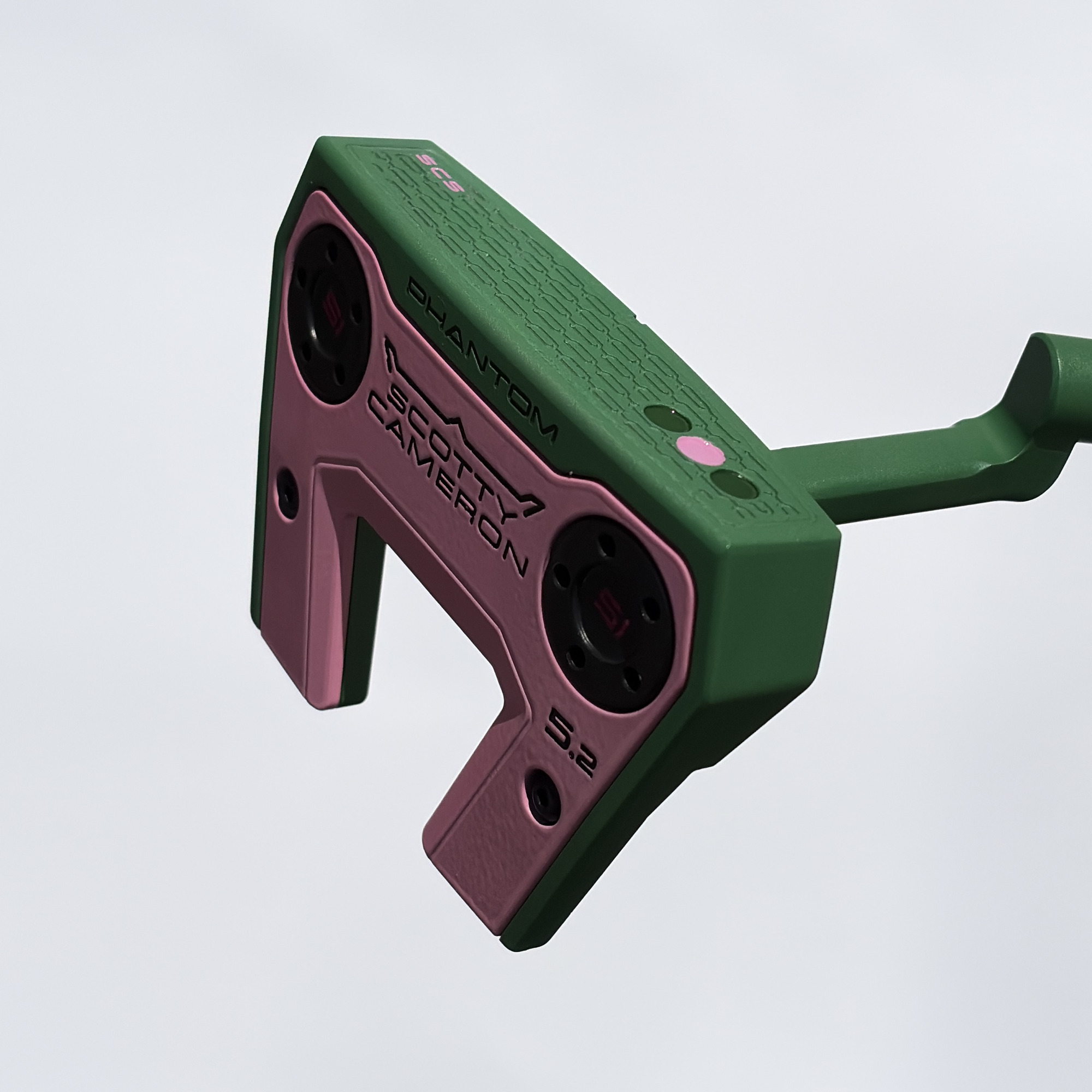 Sole of the custom painted Phantom 5.2, stamped Phantom and Scotty Cameron, finished in green with pink detailing.
